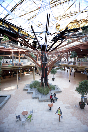 Shoppers walk around the recently finished Destiny USA Sunday. The mall’s final expansion opened in August, leaving promises of building a waterpark, hotel and aquarium, among other things, unfulfilled.