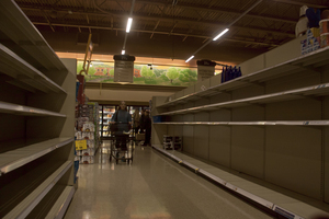 Customers walk through the empty aisles of the Wegmans store in DeWitt as area residents and students prepare for the coming storm. At the Tops Market store on Nottingham Road in Syracuse, employees said the storm brought in more business than ever before in store history.