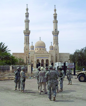 A military transition team patrols with Iraqi soldiers outside the Um Altobol mosque in Baghdad, Iraq in March 2007, four years after the U.S. launched Operation Iraqi Freedom.