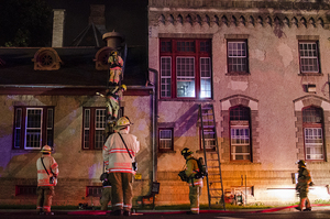 Firefighters put out a fire at the rear of the Grace Episcopal Church. 