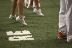 Syracuse painted Rob Edson's initials on the turf near the end zone, where he stood for every game. Edson died of an apparent heart attack last Saturday.