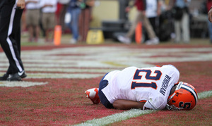 Julian Whigham lays on the turf after colliding with Syracuse safety Jeremi Wilkes in the end zone. The SU cornerback was carried off the field in a stretcher.