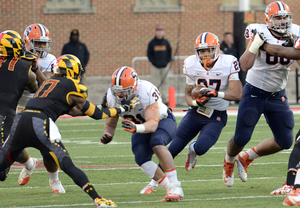 George Morris II runs through a hole in the second quarter. The Syracuse running back carried the ball seven times for 50 yards.