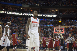 Rakeem Christmas walks off the court at First Niagara Center after Dayton beat Syracuse 55-53 on Saturday. Christmas kept the Orange in the game during the first half on both ends of the floor.