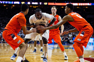 Michael Gbinije and Chris McCullough converge on Villanova's JayVaughn Pinkston in the lane. Both SU forwards fouled out, along with Rakeem Christmas.