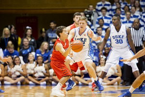 Sean Kelly (center) is Duke's least-used player, but just being on the team is a milestone for him. He made the roster after spending his first three years of college as the Blue Devils' team manager.