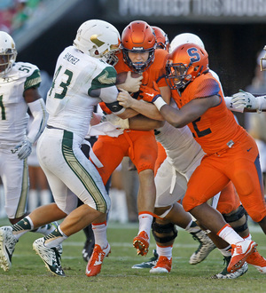 SU freshman running back Jordan Fredericks (right) was a bright spot on an up-and-down day for Eric Dungey (middle) and the Orange offense.