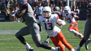 Devin C. Butler (13) goes for a tackle at Connecticut last season on special teams. 