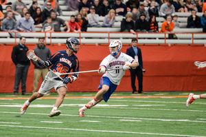 Virginia attack Michael Kraus, left, scored four goals last year against Syracuse in an SU win.