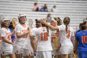 Syracuse celebrates a goal against Florida. The Orange went on a scoring frenzy in the second half to pull away from Harvard.