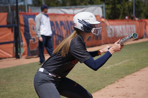 Toni Martin performs her pre-swing ritual, squaring to bunt before assuming her stance.