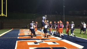 Areh Boni is lifted in the air by an offensive lineman after one of his three rushing touchdowns on Friday night for Skaneateles.