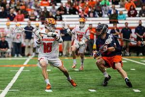 Brendan Curry looks to pass the ball in Syracuse's loss to Virginia.