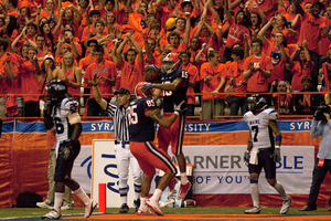 Alec Lemon (15) celebrates a second-quarter touchdown catch with tight end Jose Cruz.