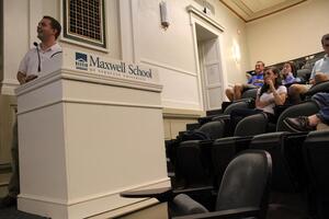 Neal Casey, SA president, addresses members at Monday night's meeting in Maxwell Auditorium. Members discussed plans for recruiting more student representatives. 