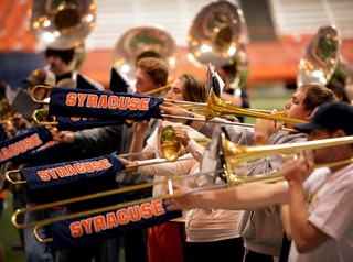 The SU Marching Band trombone section shows its school spirit.