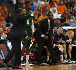 Wagner head coach Bashir Mason (left) signals to his team.