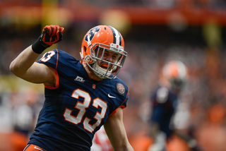 Syracuse linebacker Dan Vaughan celebrates following making a play.