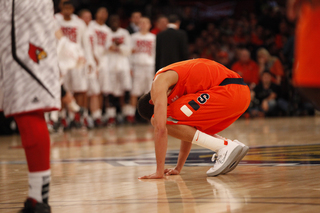 Michael Carter-Williams has trouble standing after getting hit in the gut in the paint.