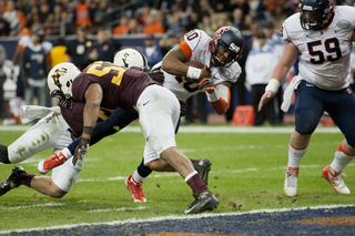 Hunt lunges forward for his first of two rushing touchdowns.