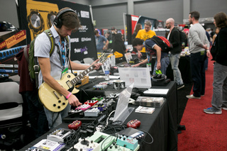 Ivan Brave, an Austin native, tries out an EarthQuaker device at the SXSW Music Expo at the Austin Convention Center on March 13, 2014. The EarthQuaker devices changes boost, compression, delay, and other sound factors on electrical guitars.