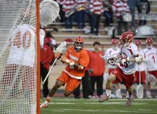 Midfielder Hakeem Lecky dodges past a Cornell defender with his eyes on the goal. 