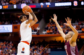 Gbinije takes a jump shot over Damon Sherman-Newsome. Gbinije scored in double figures for the fourth time in five games. 