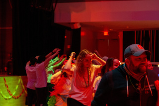 Students run into Goldstein Auditorium amidst the miracle kids and their families ready to kick off the event. 