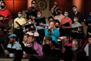 Choir members and instrumentalists during the performance. 