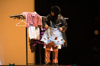 Jamison Brown, representing Jamaica, shares clothing that he reworked from old and fast fashion materials during the talent portion of the pageant. His inspiration in the patchwork of his denim shorts was stars in a galaxy, he said.